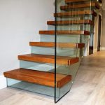 Floating modern glass stairs with glass riser