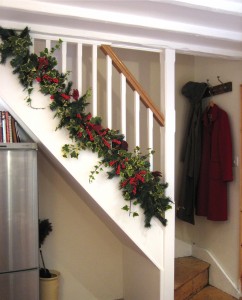 Traditional stairs with holly garland