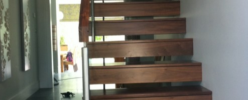Floating Tread Stairs in walnut-glass