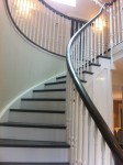 curved cut string stairs with painted risers