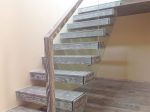 Floating oak stained treads stairs with glass balustrade