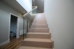 modern-cut-string-stairs-with-freestanding-glass-balustrade-12