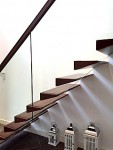 Modern Cantilever stairs with open risers and glass balustrade