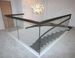 curved stairs with glass balcony